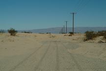 Main road covered with sand